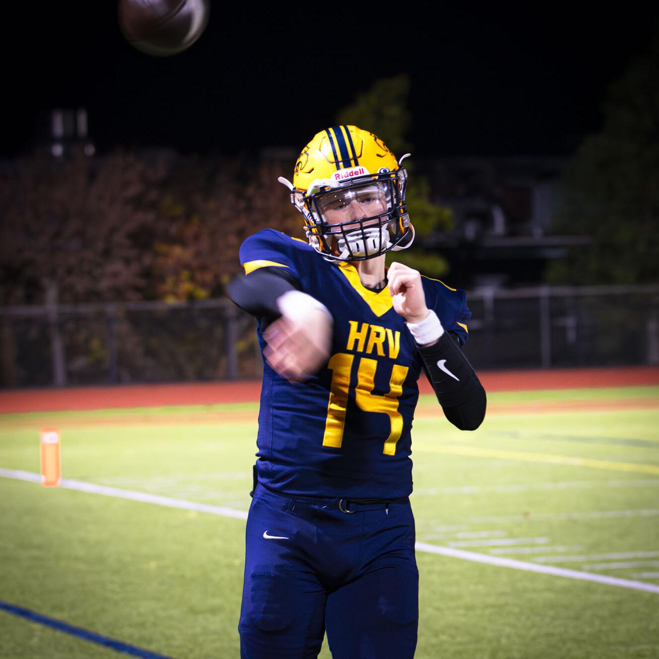 Hood River Valley quarterback Bodie Stuben (14) throws a pass on the sideline against Parkrose on Oct. 30   Zach Thummel photo